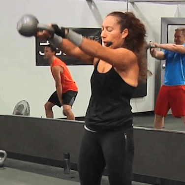 Instructor teaching a kettlebell class