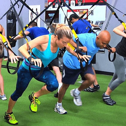 Instructor teaching a TRX class