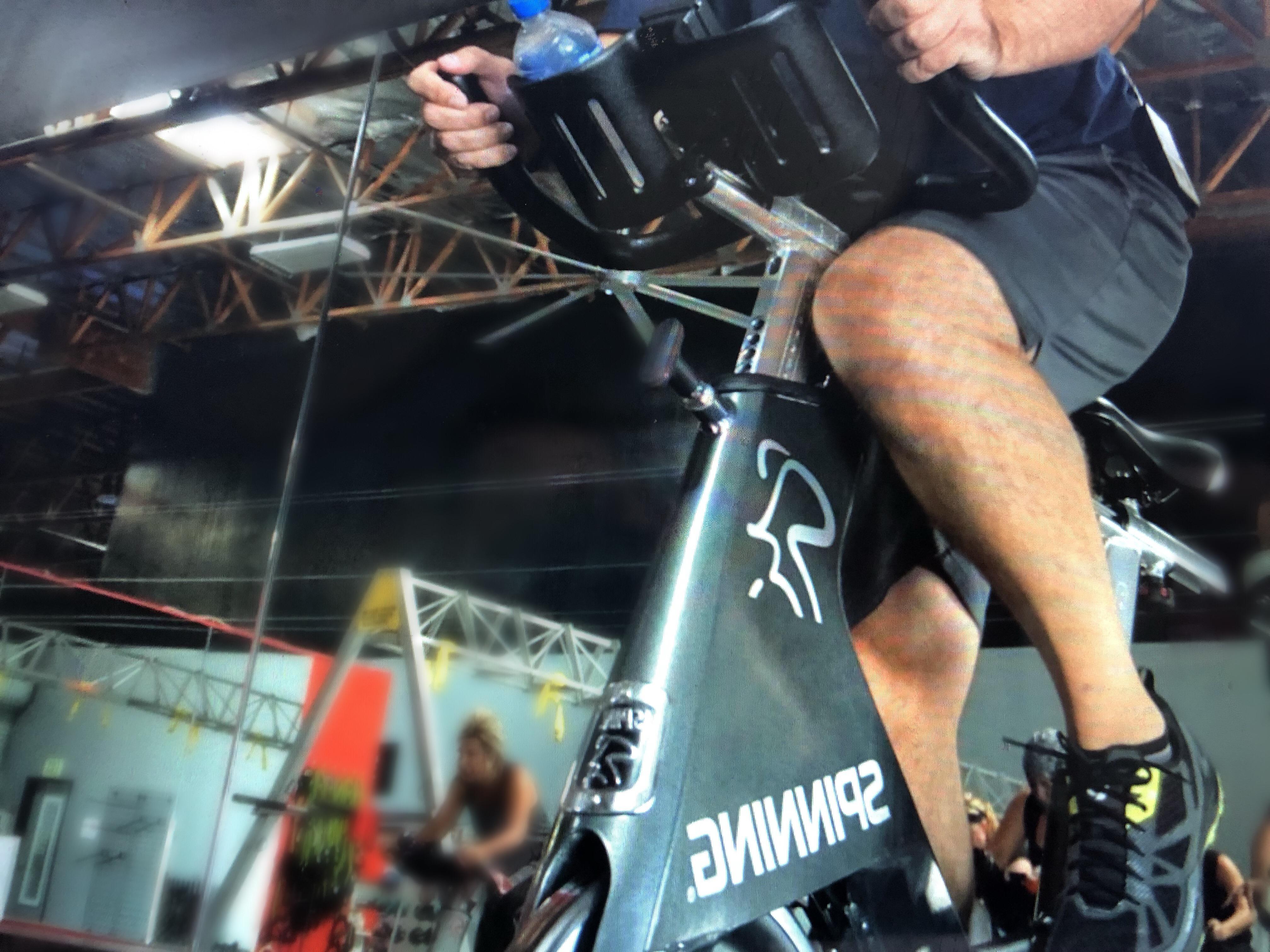 Why Spinning Is a Push and Pull Workout spin class close up on legs