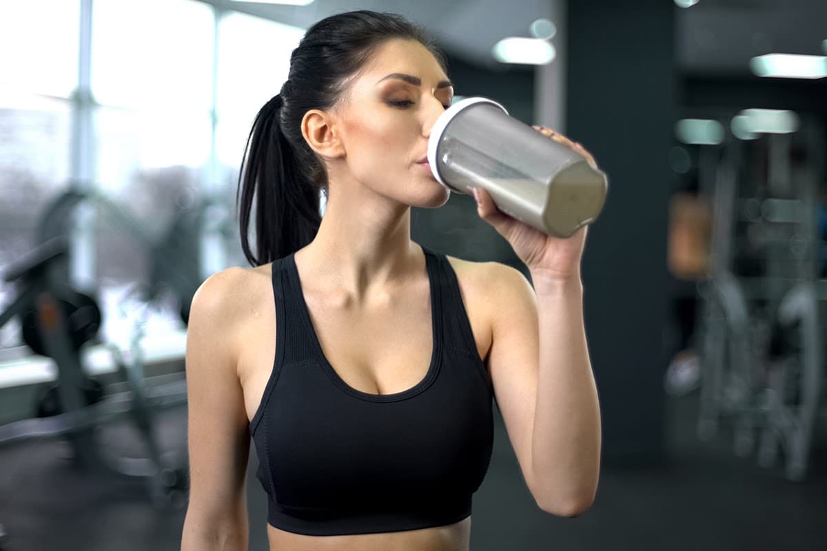 woman drinking protein shake