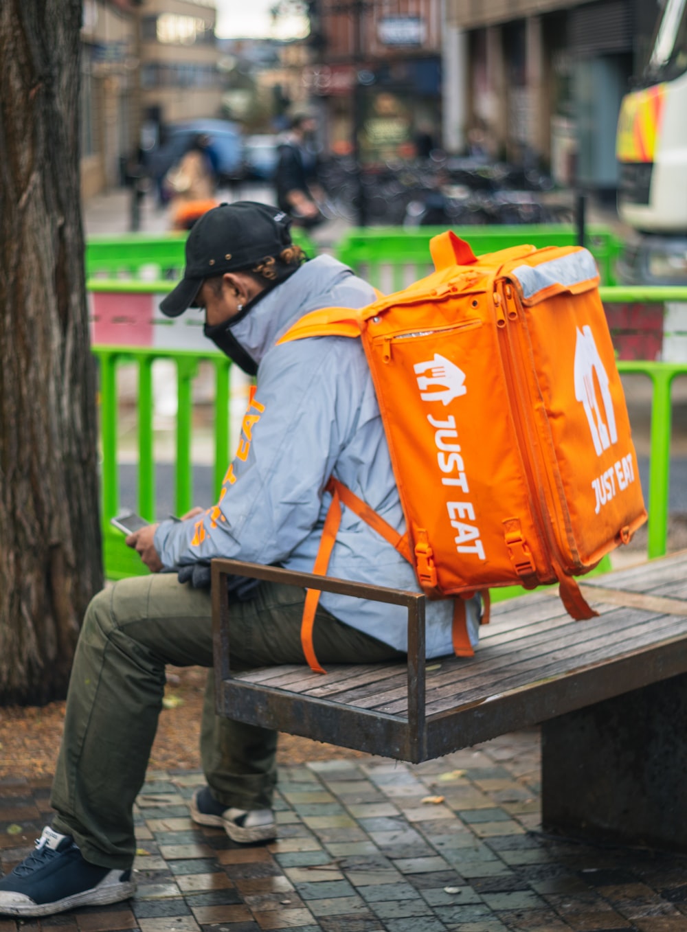 Image of a food deliverer with an orange backpack