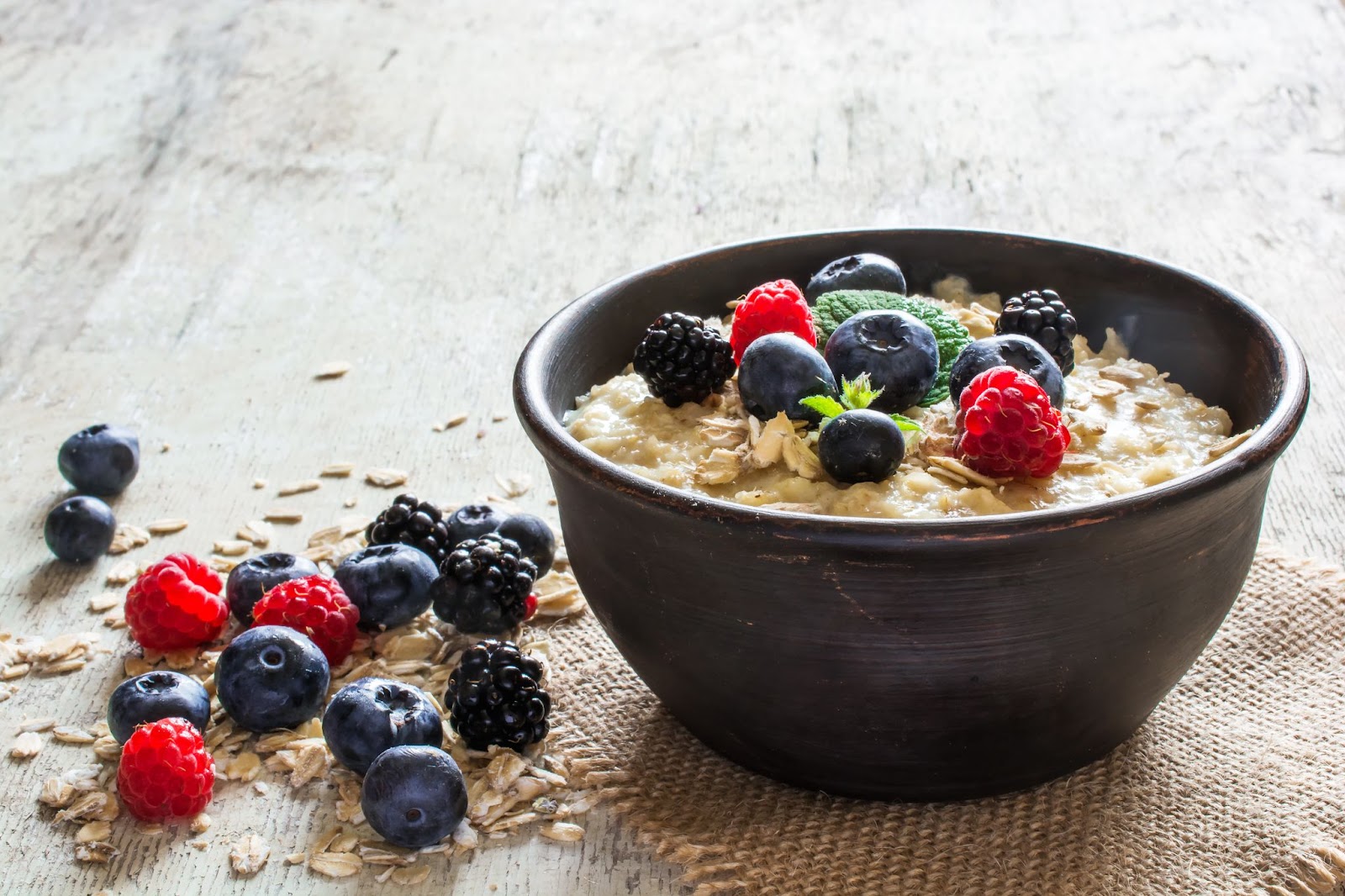 Bowl of oatmeal with fresh fruit on top