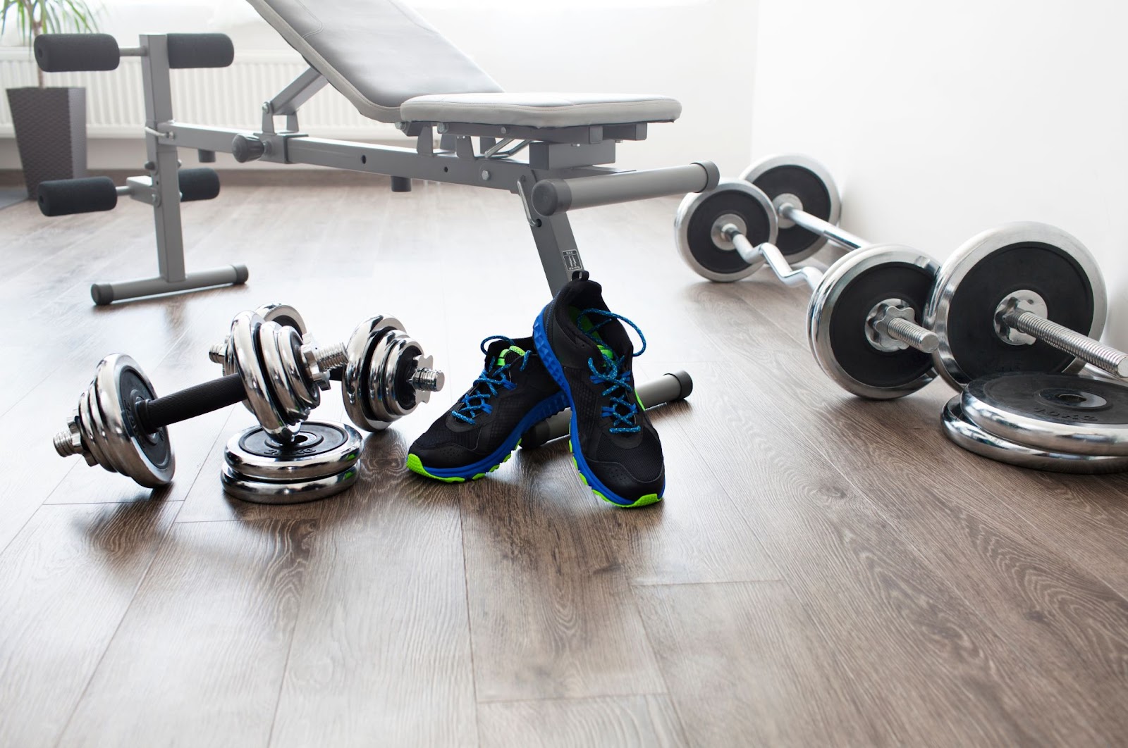 Image of home gym equipment, including shoes and dumbbells