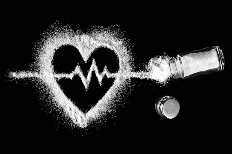 Stylized image of spilled salt shaker, in the form of a heart EKG