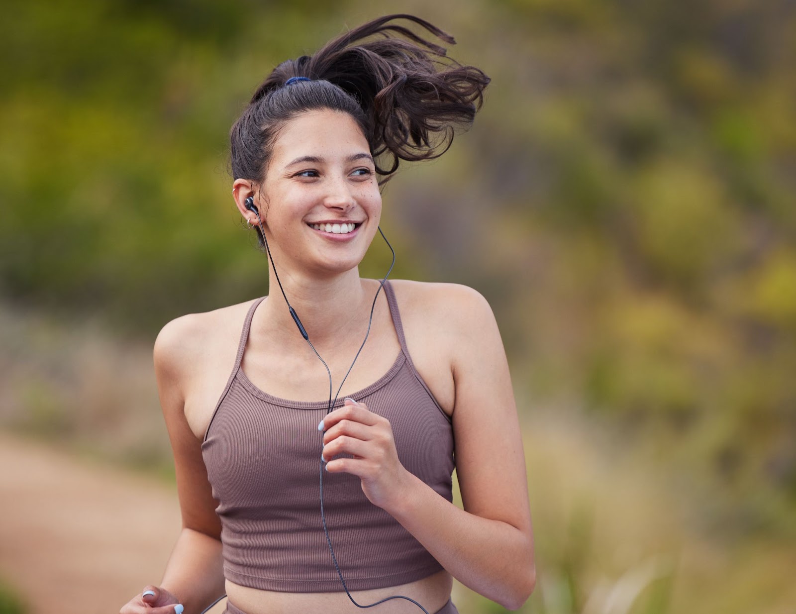 Young fit woman going for a long run outdoors
