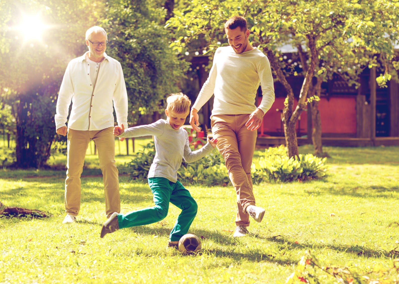 Family playing a soccer game during the holidays