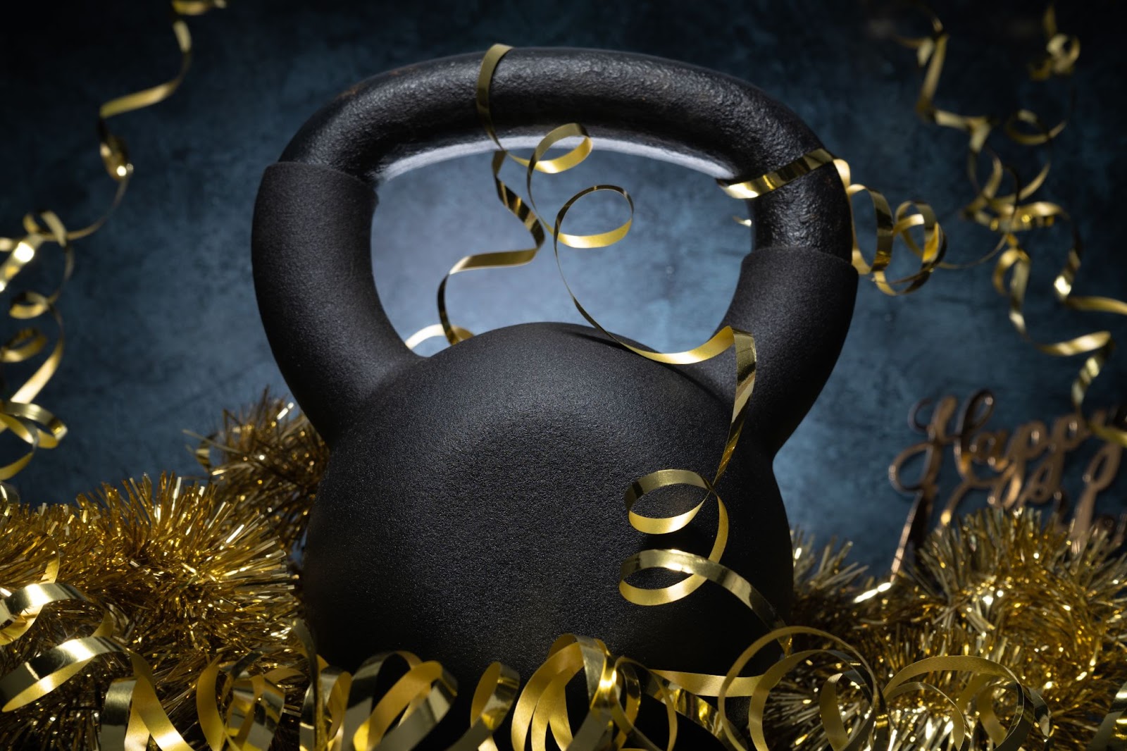 Image of a kettlebell surrounded by gold confetti