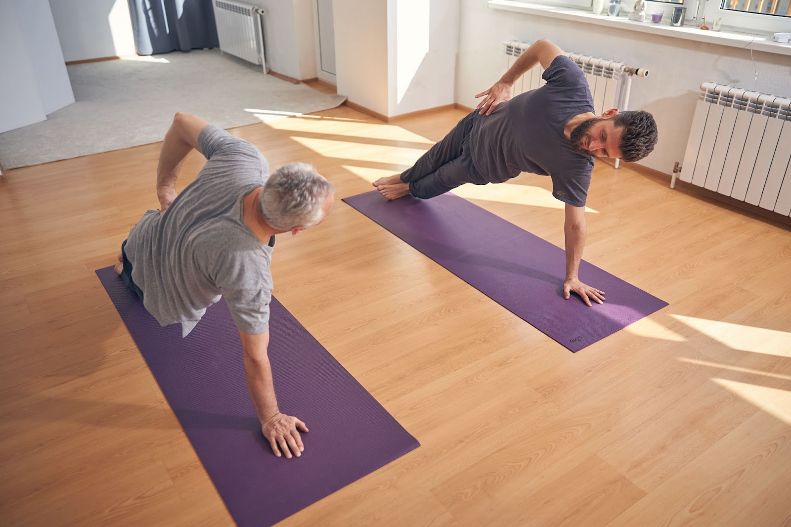 men doing yoga in studio