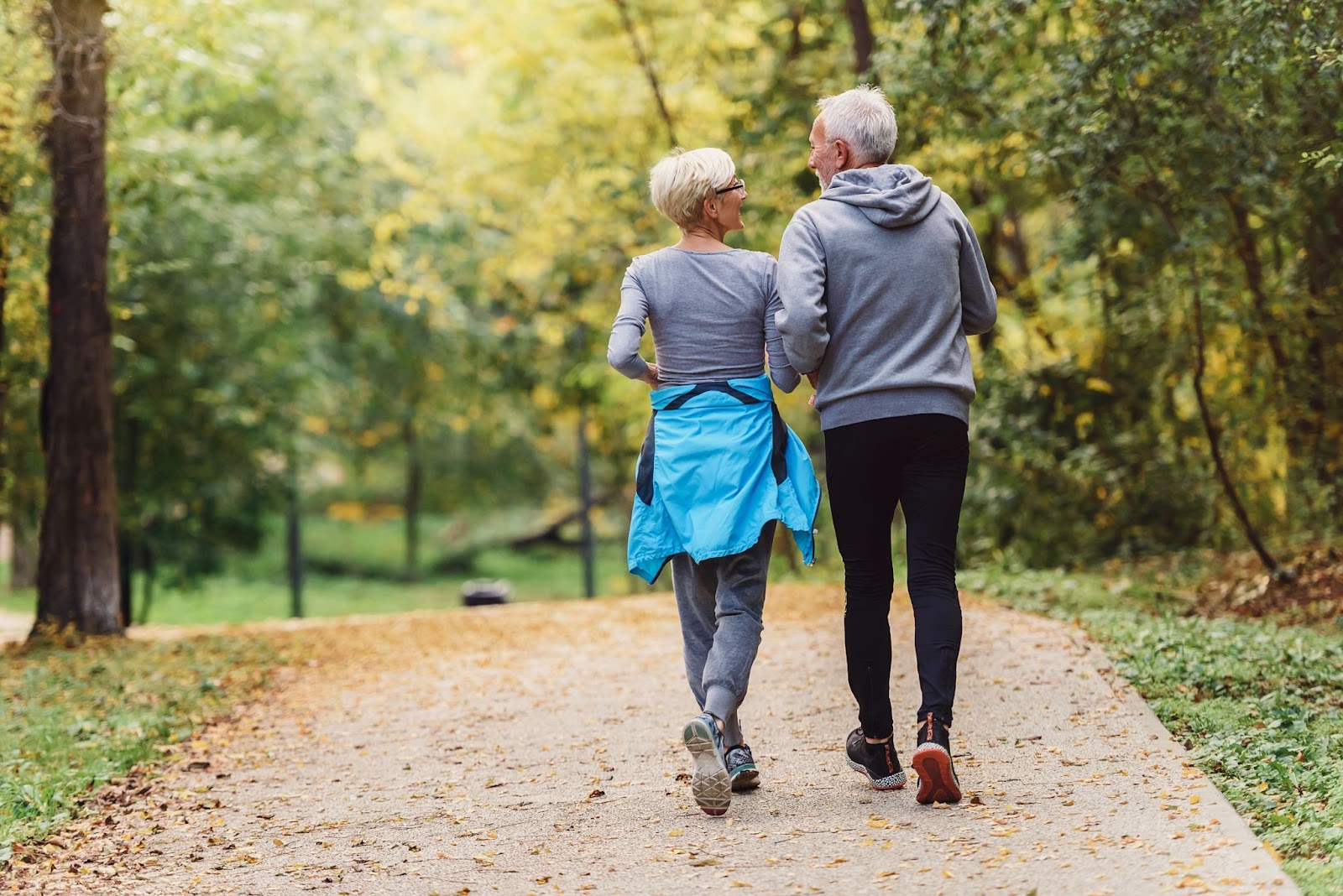 Elderly couple walking in a park together