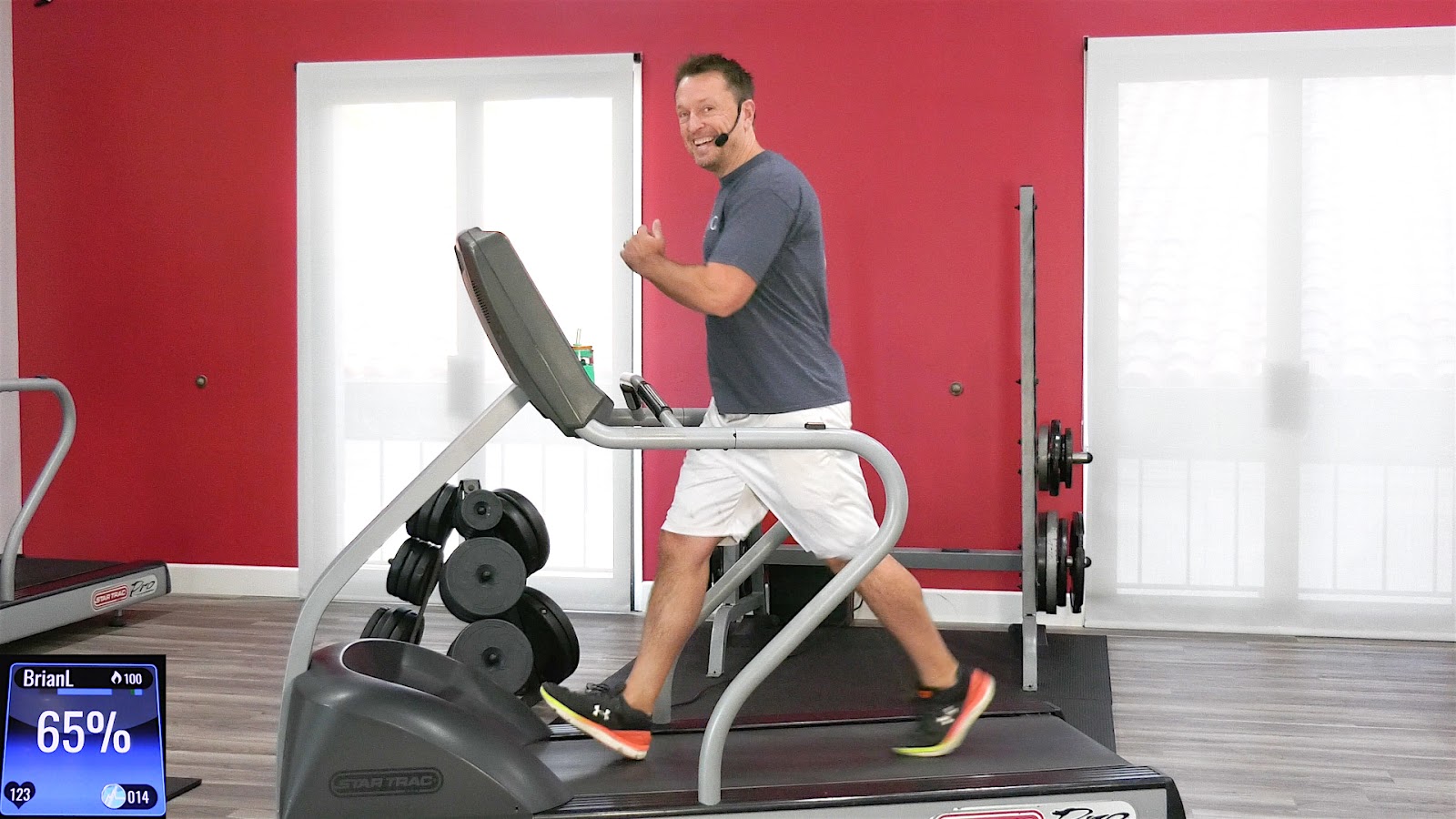 Studio SWEAT onDemand trainer Brian teaching a treadmill virtual workout
