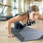 Fit woman performing a knee plank