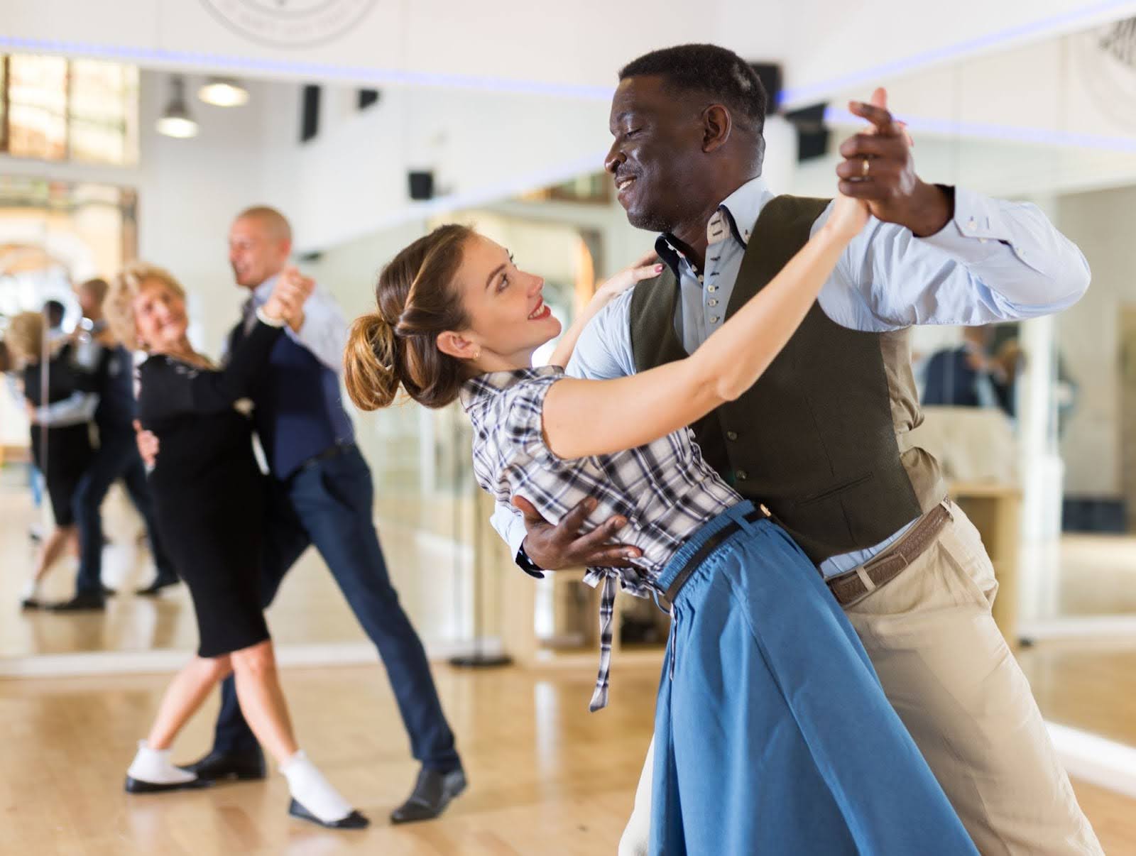 Young couple dancing in a ballroom dancing class