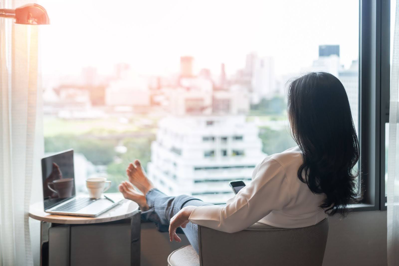 Female professional relaxing in her chair while at work