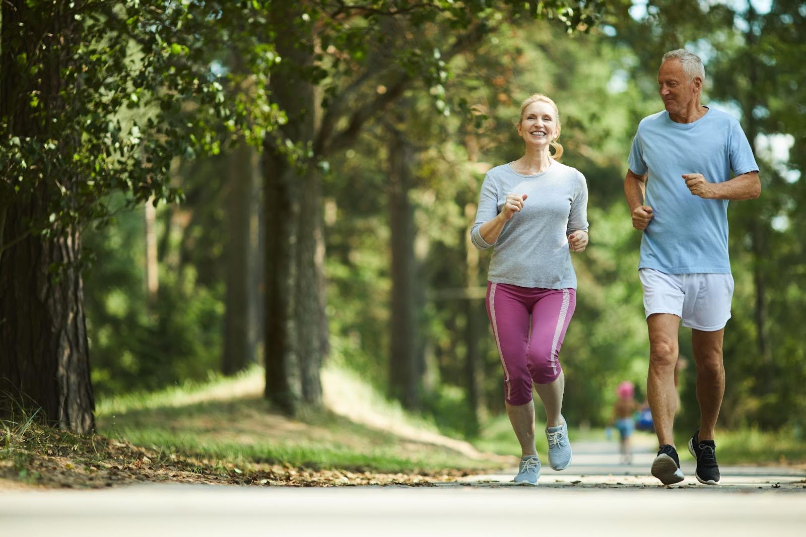 Healthy older couple going for a jog outside